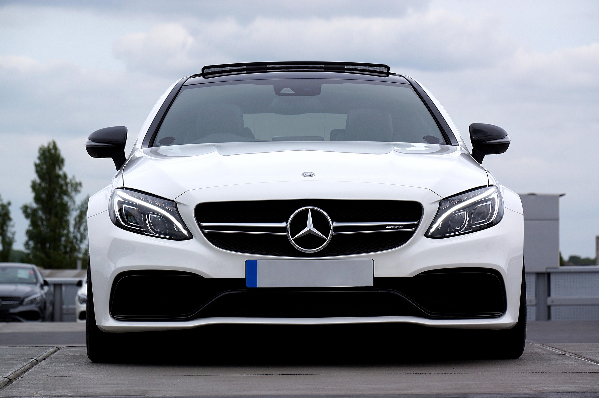 White Mercedes C63 with clean glass profile